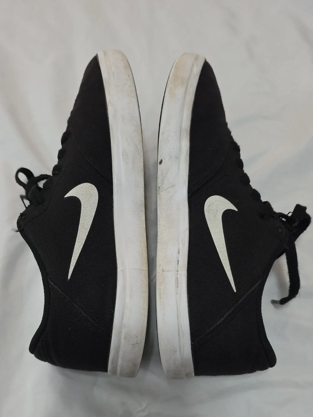 Nike Black Low-Top Sneakers with White Swoosh